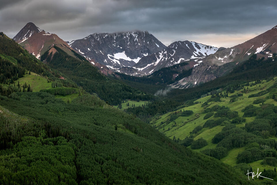 Limited edition print of Colorado’s Capitol Peak and the Capitol Creek Valley colored in the greens of early summer.