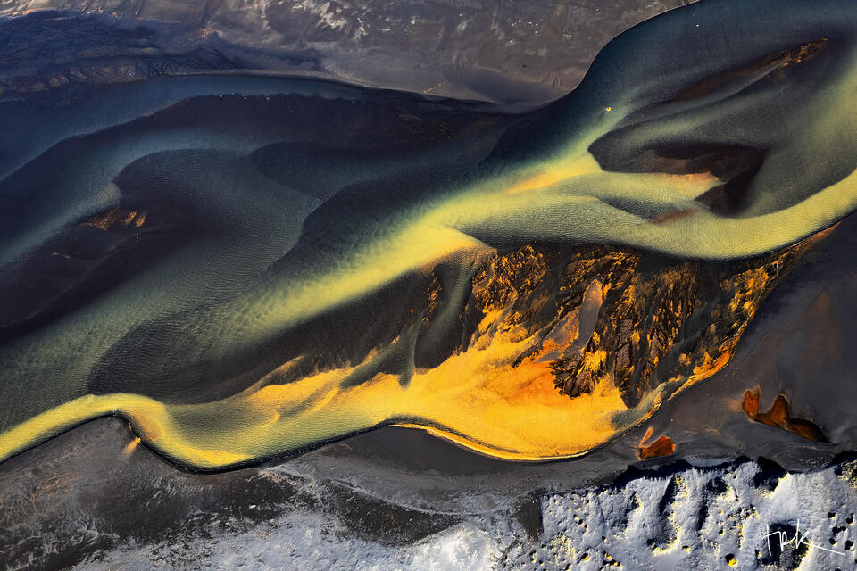 Limited edition print of an abstract Icelandic scene created by mineral-infused river water traveling across a black sand beach.