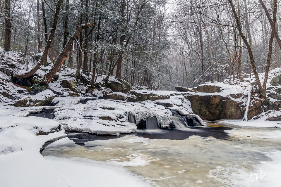 Limited edition print of the first waterfall at Enders Brook in Granby, Connecticut covered in an early winter snowfall.