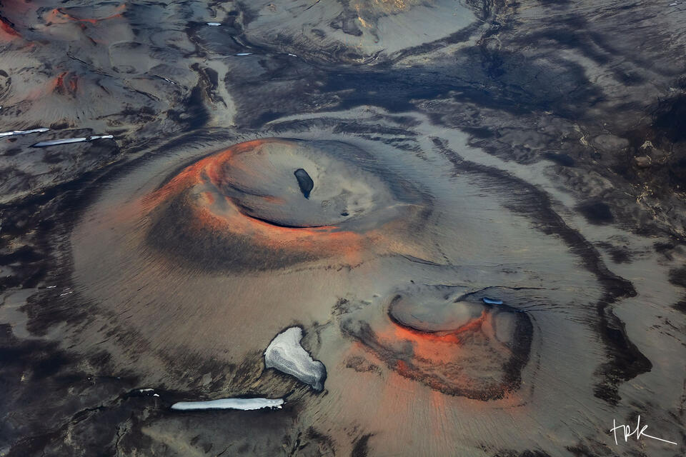 Limited edition print of an aerial view of two red-rimmed craters in the Icelandic highland.