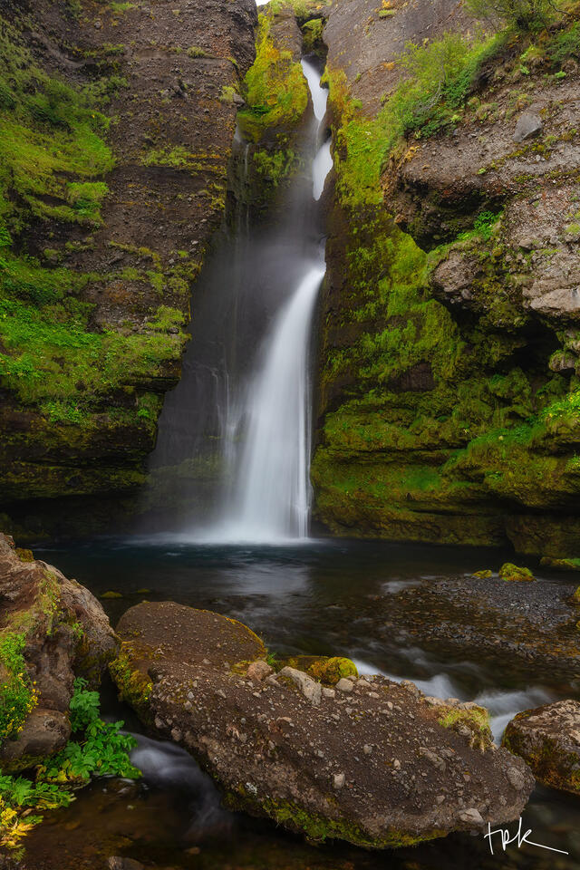 Limited edition print of Iceland’s Gluggafoss waterfall with mossy rock walls on either side.