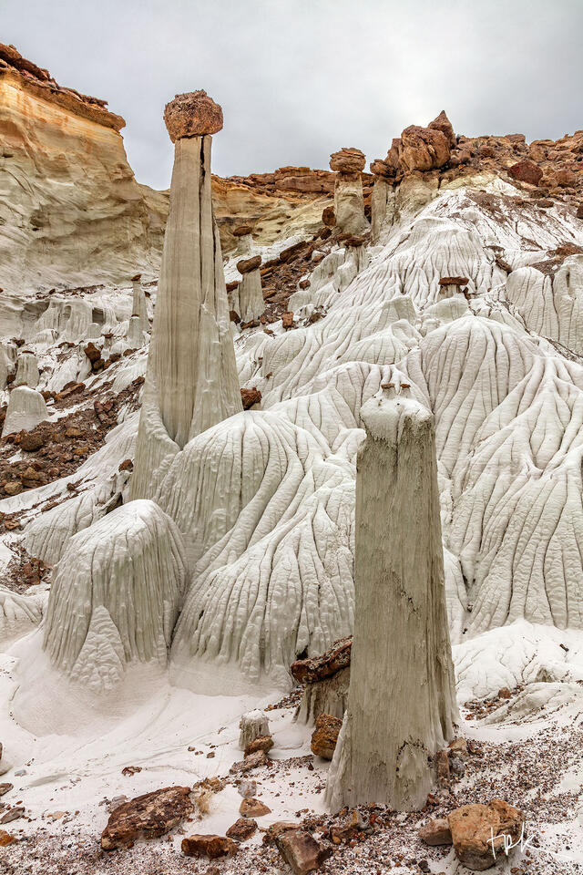 Limited edition print of white hoodoos against a hillside in southern Utah.