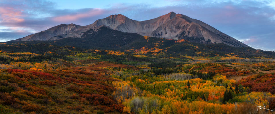 Limited edition panoramic print of Colorado’s Mount Sopris at sunrise with yellow aspen and red Gabel oak on its foothills.