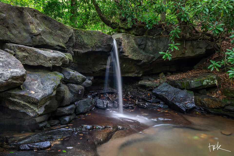 Limited edition print of a waterfall with a very light flow pouring over a ledge in Pennsylvania’s Ohiopyle State Park in summer.
