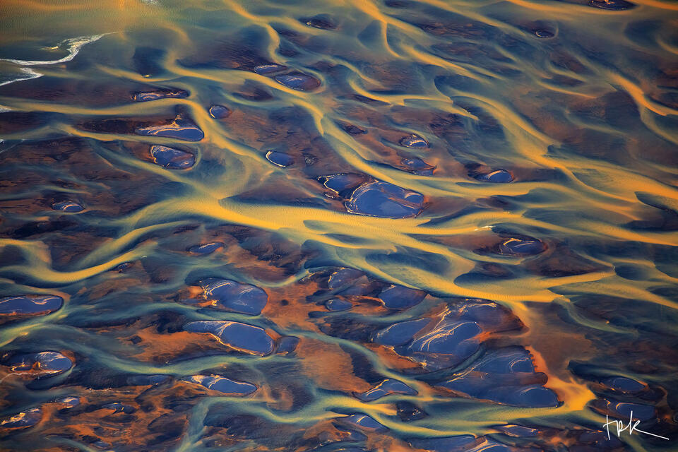 Limited edition print of an Icelandic braided river with yellow water.