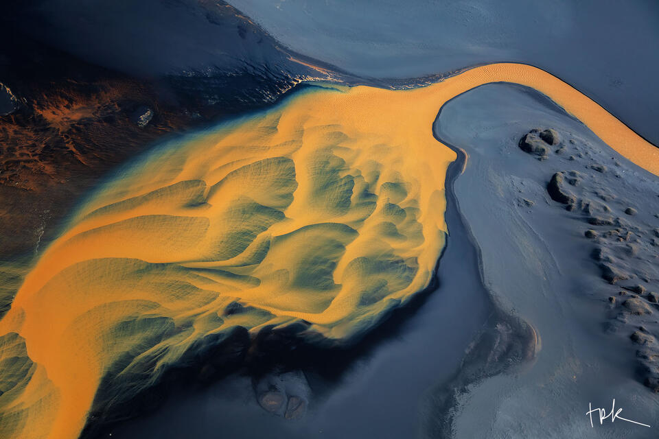 Limited edition print of an abstract Icelandic scene created by mineral-infused river water traveling across a black sand beach.