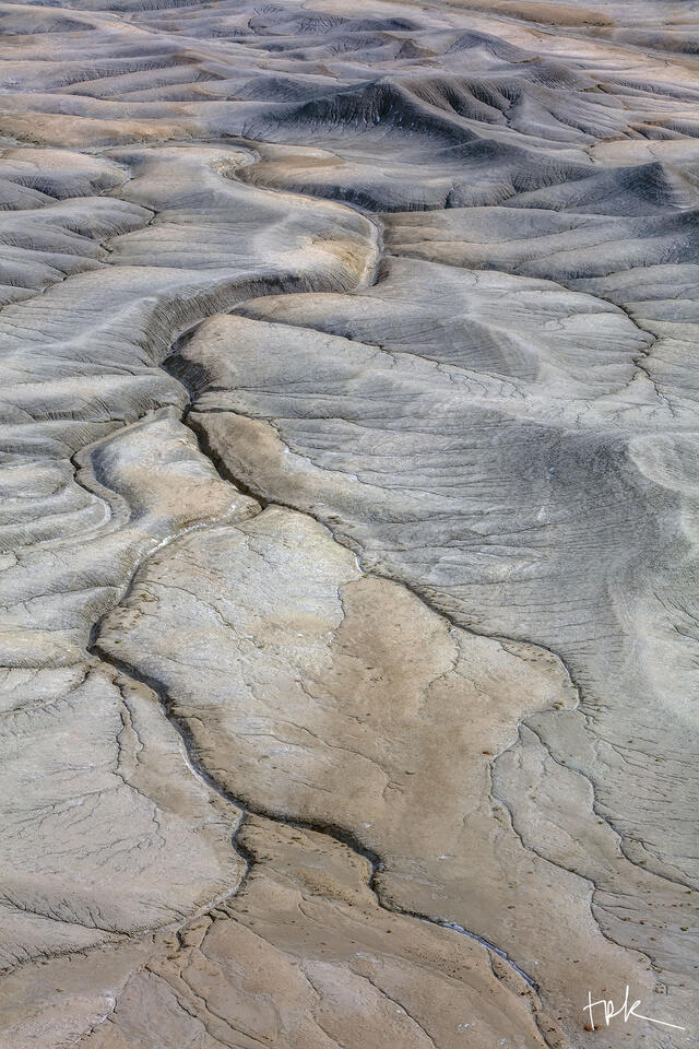 Limited edition print of water channels on a sandstone valley floor near Hanksville, Utah.