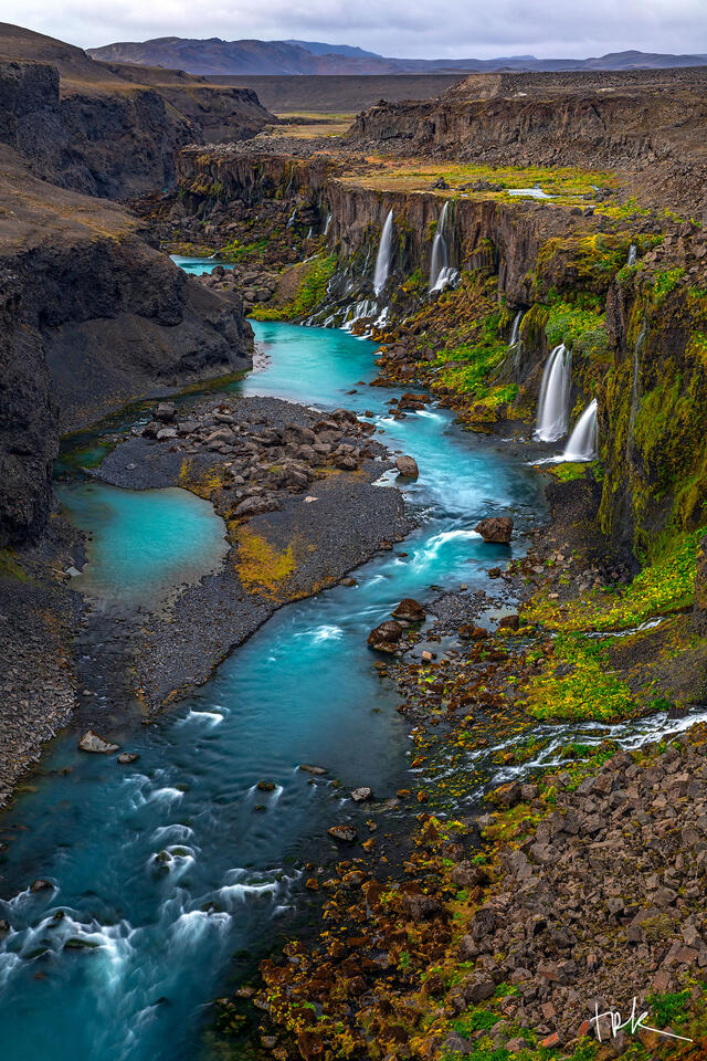 Limited edition print of Iceland’s Sigöldugljúfur with waterfalls coming from the rock face of the canyon and spilling into a turquoise-colored river below.