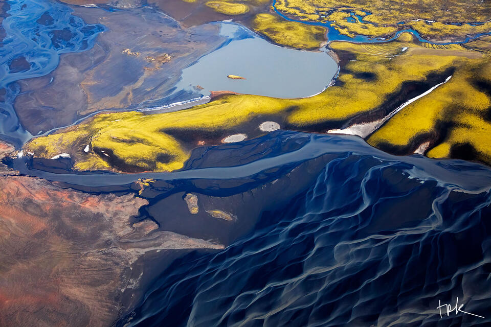 Limited edition print of an aerial view of the Icelandic highland landscape, including a river, a lake, and moss-covered hills.