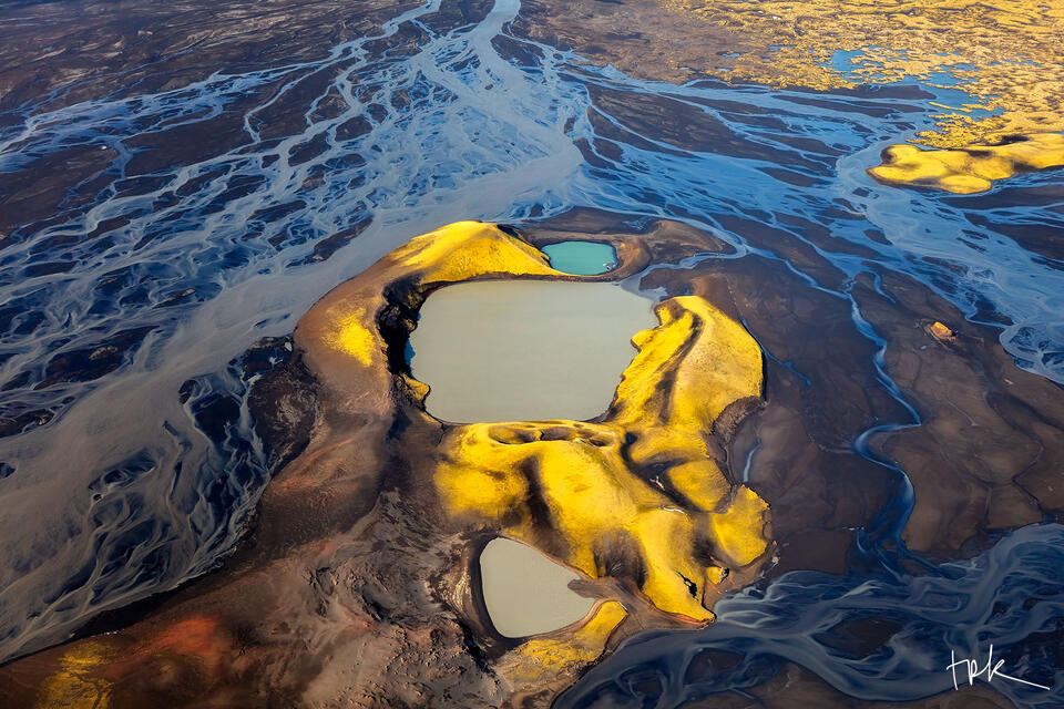 Limited edition print of an aerial view of the Icelandic highland landscape, including a river, a lake, and moss-covered hills.
