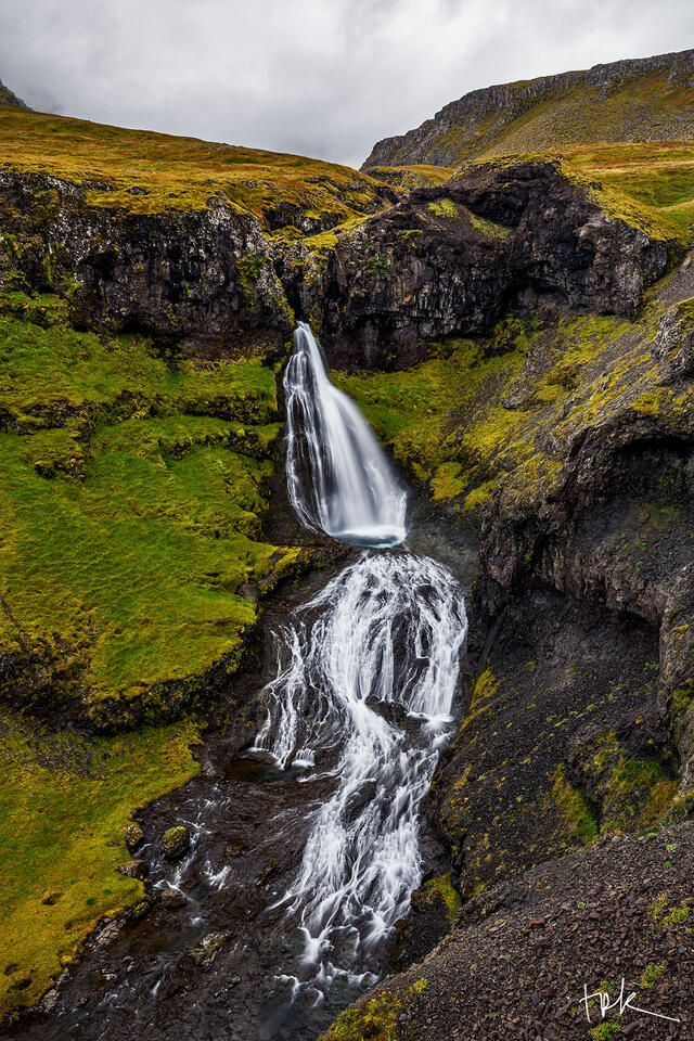 Limited edition print of a Snæfellsnes waterfall with two sections: an initial drop and then a threaded fan hugging the rock face below.