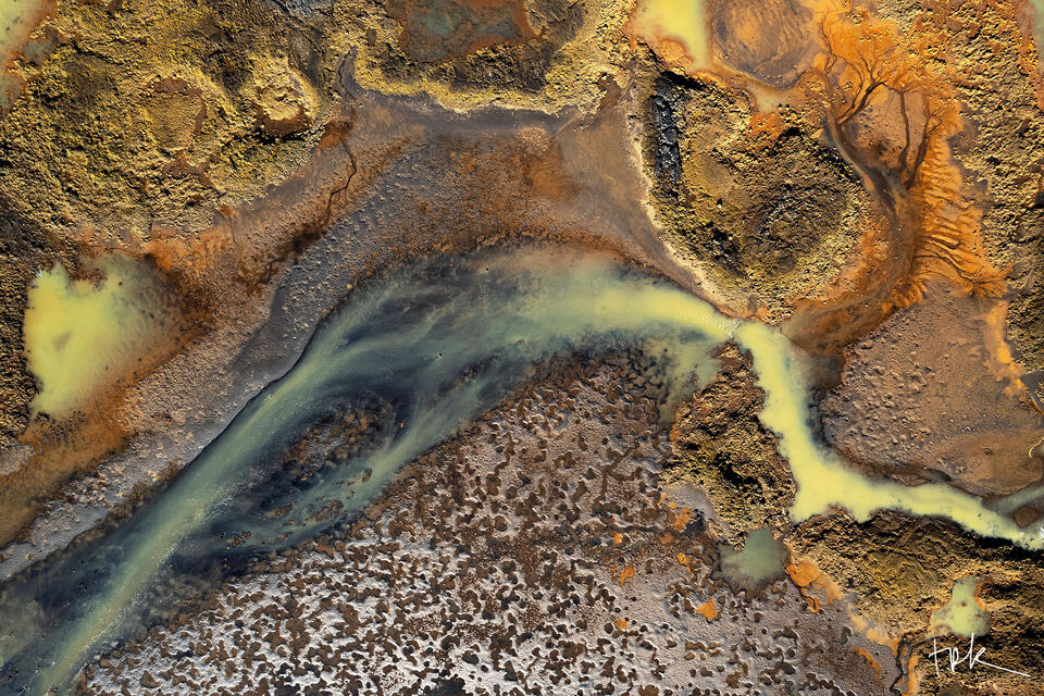 Limited edition print of an abstract Icelandic scene created by mineral-infused river water traveling across a rock surface near the coast.