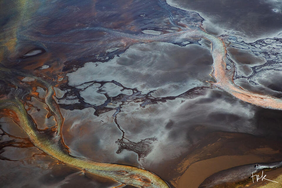 Limited edition print of an aerial image of the river, Þjórsá, where the water has taken on an iridescent appearance in the sun.