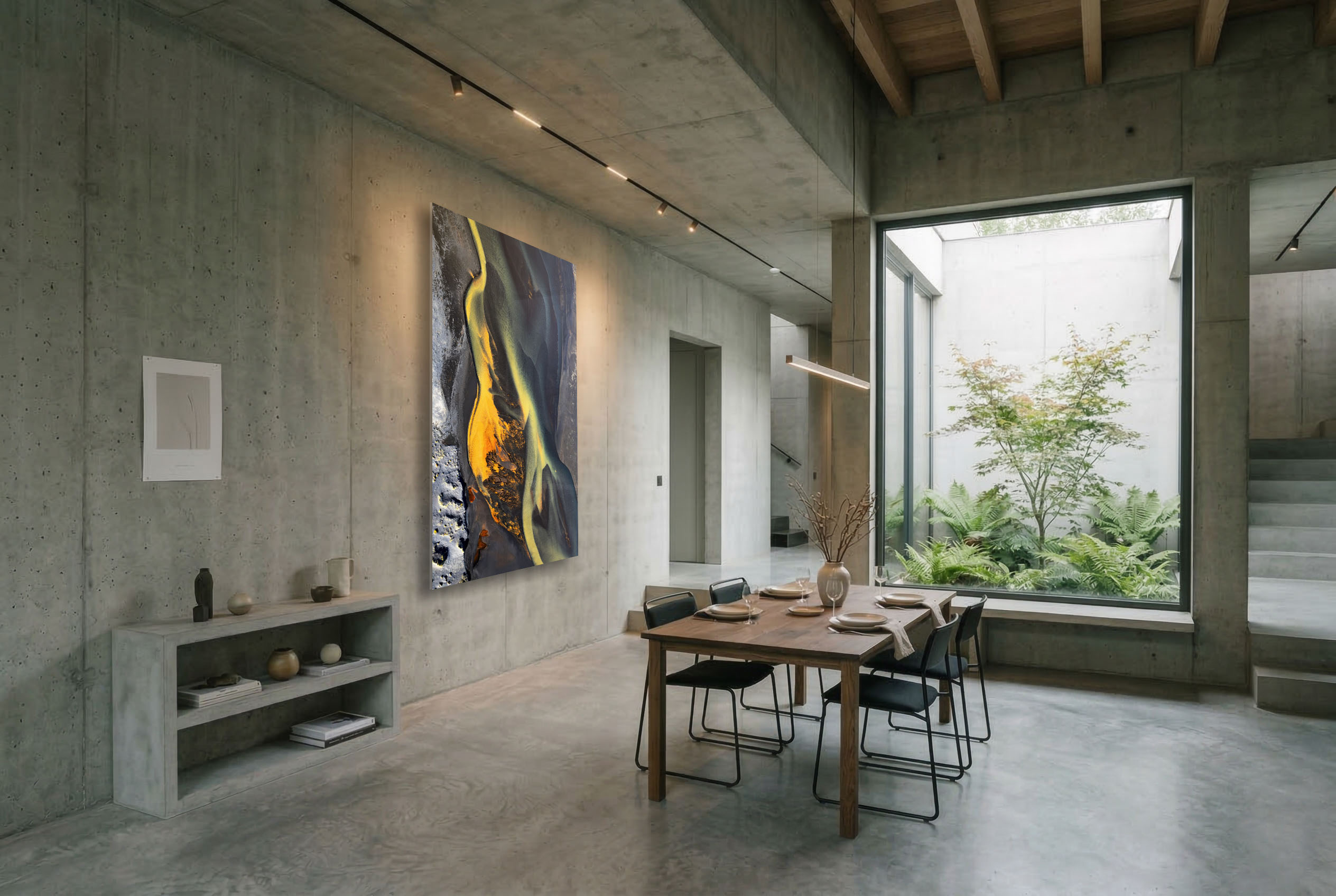 Abstract aerial river fine art landscape photograph displayed in a modern dining room interior.