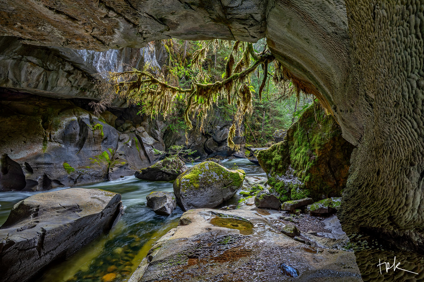 Tunnel View Limited edition print of Vancouver Island’s Little Huson Caves Regional Park with a creek flowing through a karst cave.