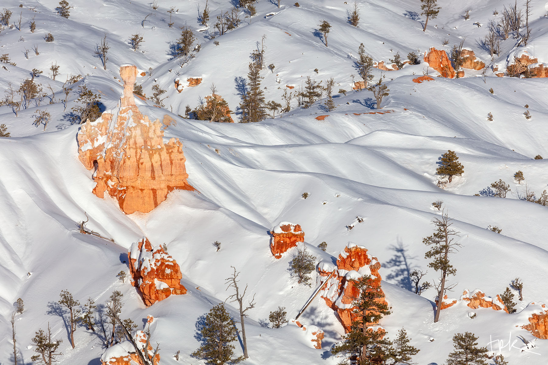 Winterglow Limited edition print of a Bryce Canyon hoodoo surrounded by drifts of fresh snow illuminated by the morning sun.